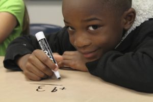 Boy doing math problem